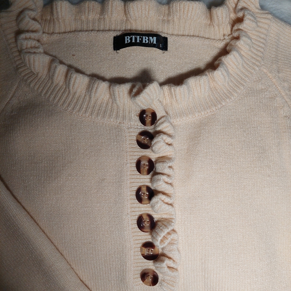 New cream sweater half button